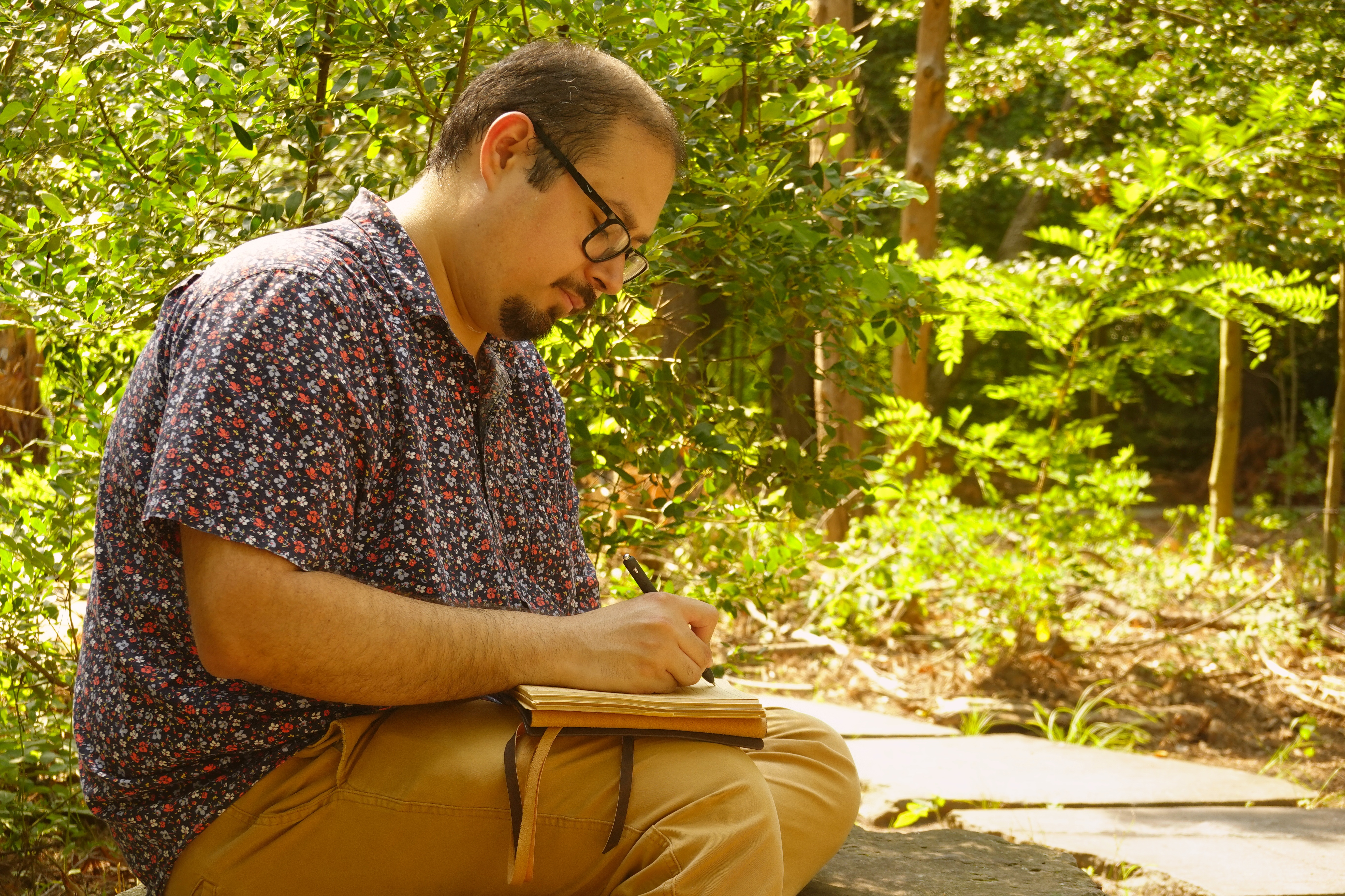 Art writing in a journal outdoors